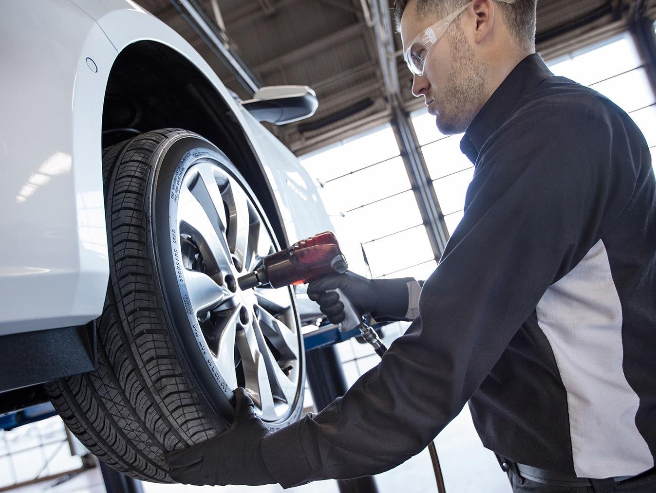 Automotive technician servicing a vehicle at Al Willeford Chevrolet